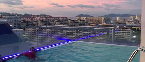 Outdoor pool, a rooftop pool, pool loungers