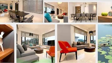 Una sala de estar moderna con un sofá gris, un sillón rojo y una mesa de centro.