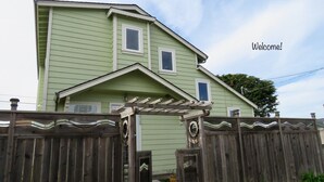 A green house with a wooden fence and a pergola. - Enjoy Fresh Ocean Breezes, No Crowds In Small Community Setting (Bodega Bay)