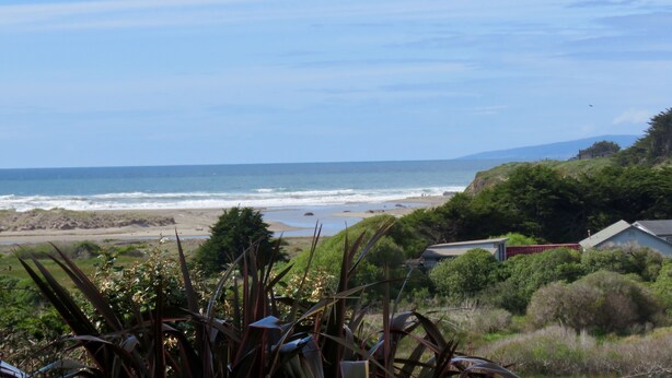 A coastal landscape with a beach, ocean, and vegetation. - Enjoy Fresh Ocean Breezes, No Crowds In Small Community Setting (Bodega Bay)