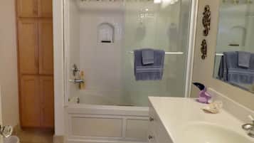 Combined shower/tub, hair dryer, towels, soap