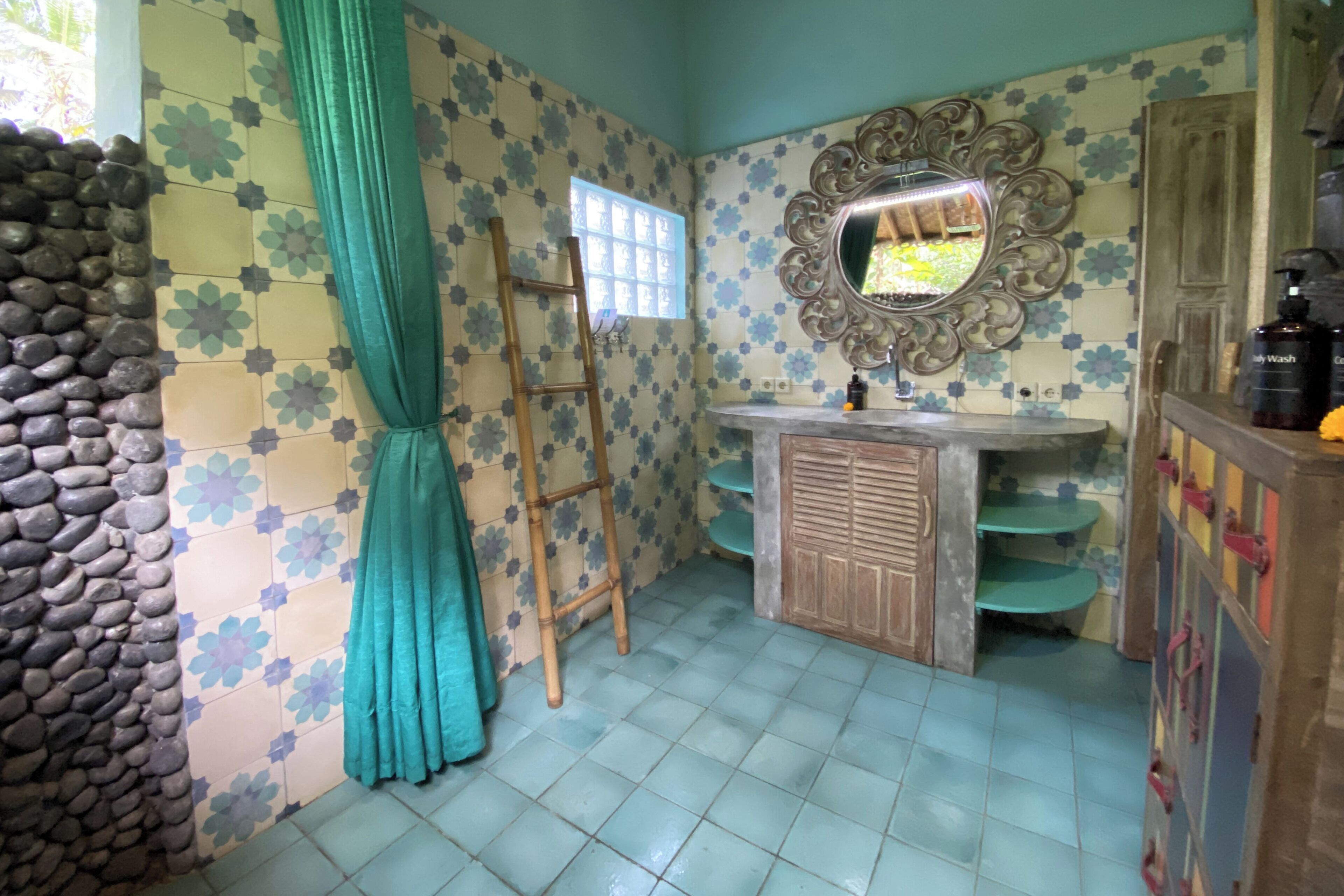 A bathroom with a tiled floor, a wooden ladder, a mirror, and a sink with a wooden cabinet.