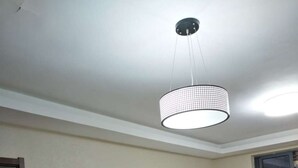 A bunk bed room with a ceiling light fixture and a sliding glass door. - Shanghai Yuelai Guest House - Hostel (Shanghai)
