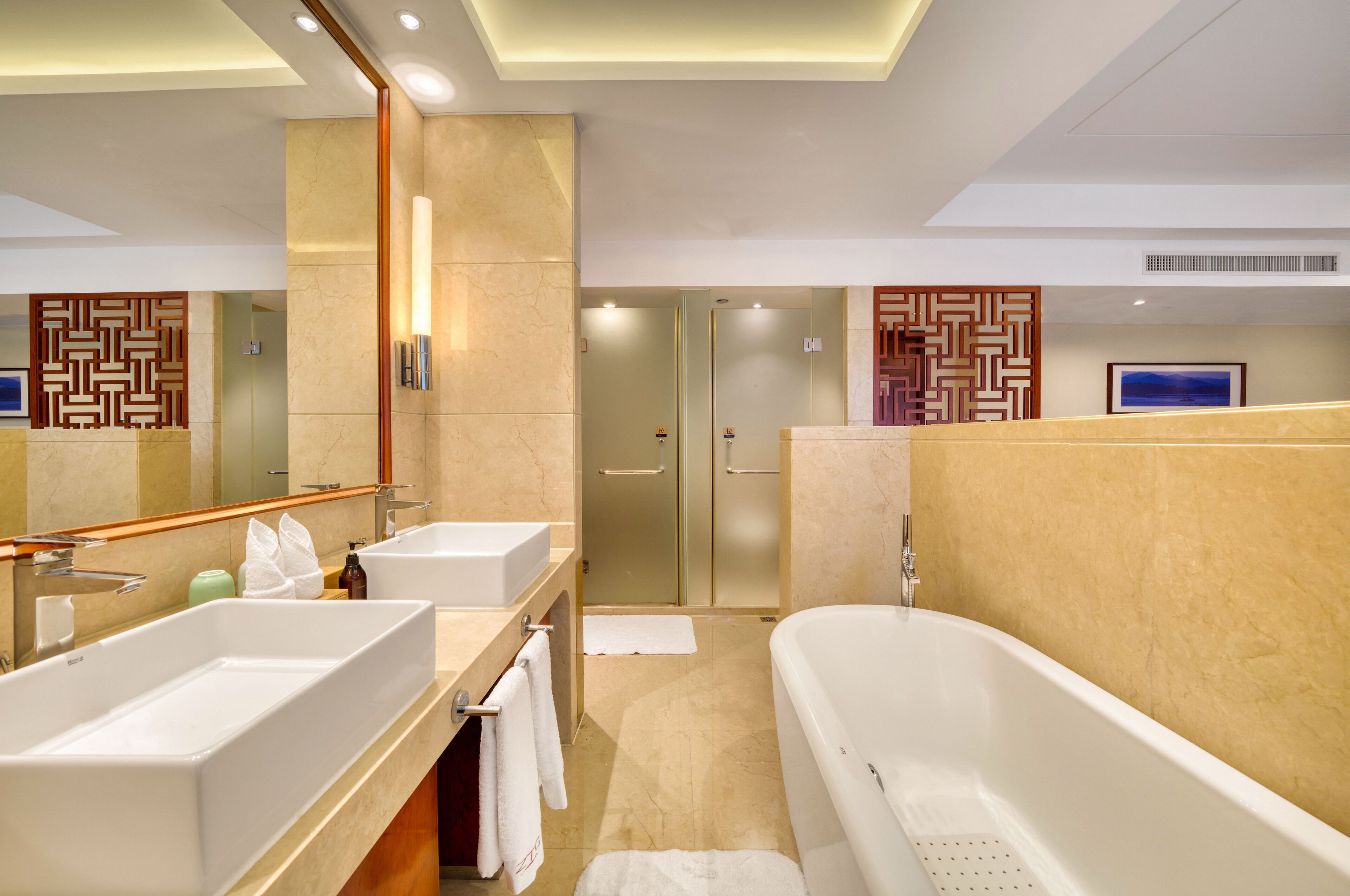 exclusive suite | bathroom | shower, hair dryer, bathrobes, slippers