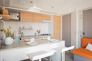 Fridge, microwave, stovetop, coffee/tea maker