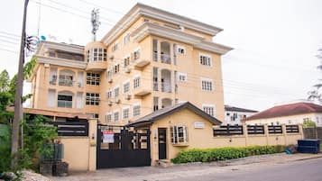 Stunning multi-story building with balconies and secure gated entrance.