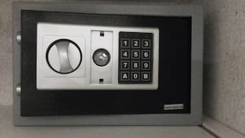 A safe with a numeric keypad and a keyhole.