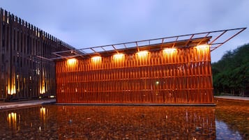 Stunning structure with a unique wooden façade and access to the water's edge.