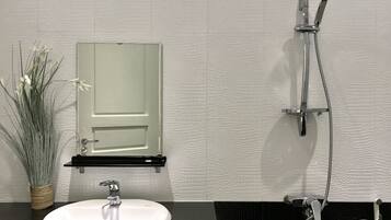 Shower, free toiletries, hair dryer, slippers