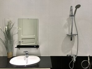 Shower, free toiletries, hair dryer, slippers