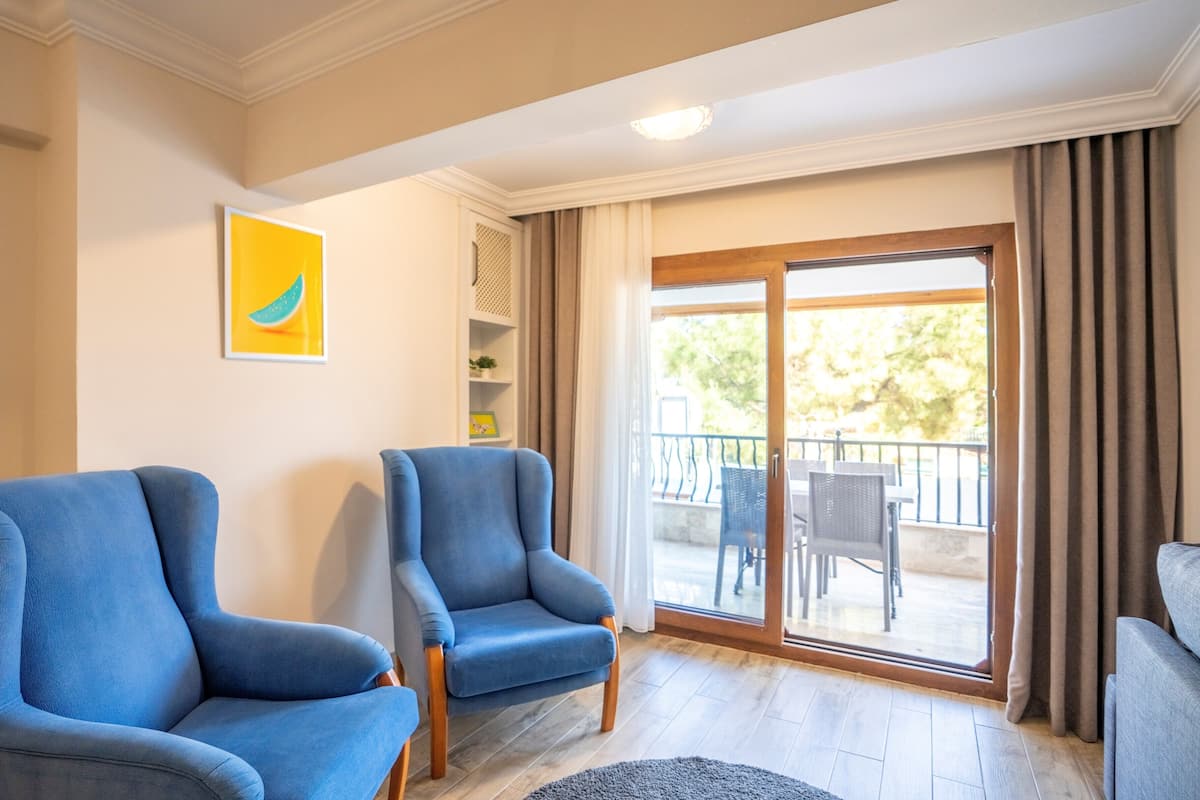 Deluxe Apartment, 2 Bedrooms, Non Smoking, Sea Facing | Living area | 30-inch LED TV with cable channels, TV