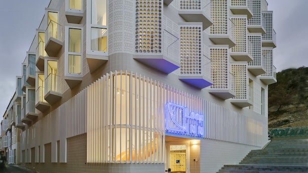 A modern building with unique geometric architecture, featuring balconies and patterned facades. - Loop INN Hostel Cartagena (Cartagena)