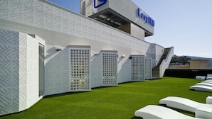 A modern building with a distinctive geometric facade and a prominent 'Loopinn' sign. - Loop INN Hostel Cartagena (Cartagena)