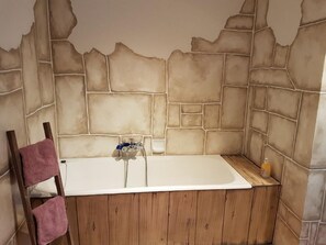 Separate bathtub and shower, hair dryer, towels