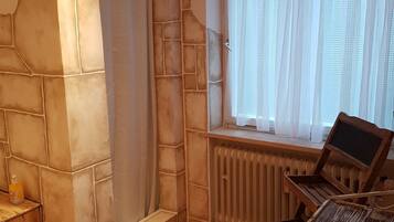 Separate bathtub and shower, hair dryer, towels