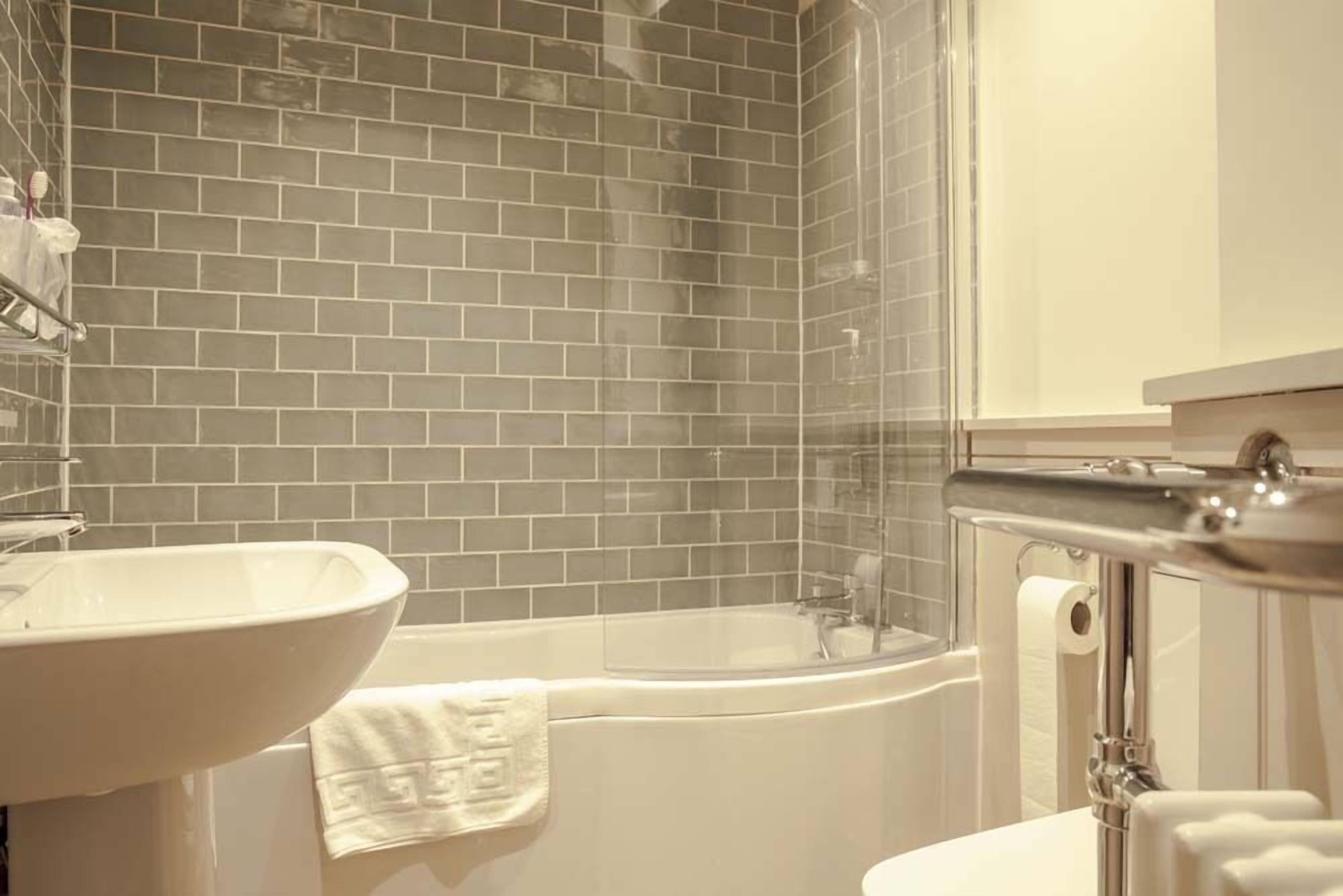 double room, 1 king bed | bathroom | shower, hair dryer, towels