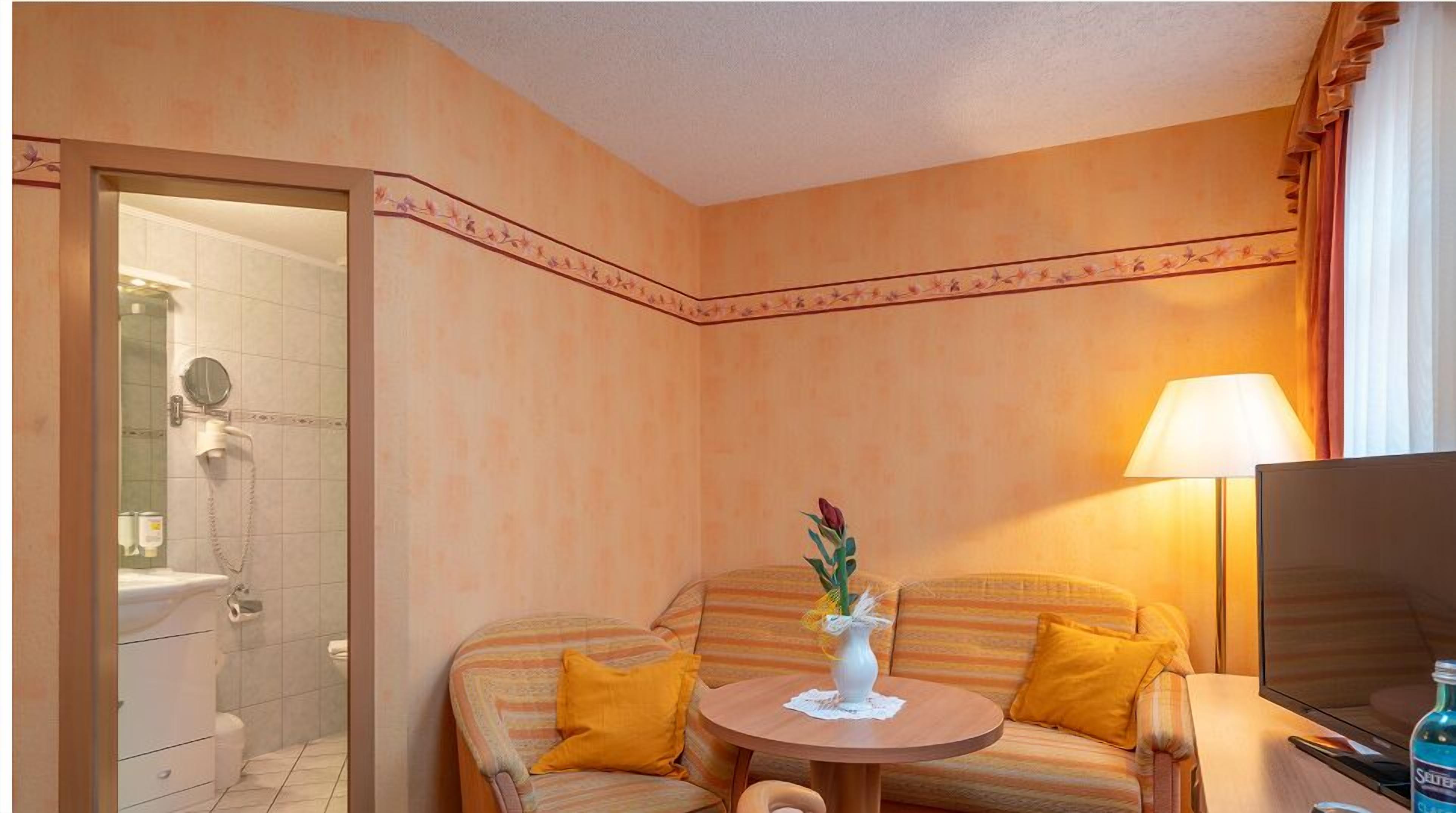 superior double room single use | living area | flat-screen tv