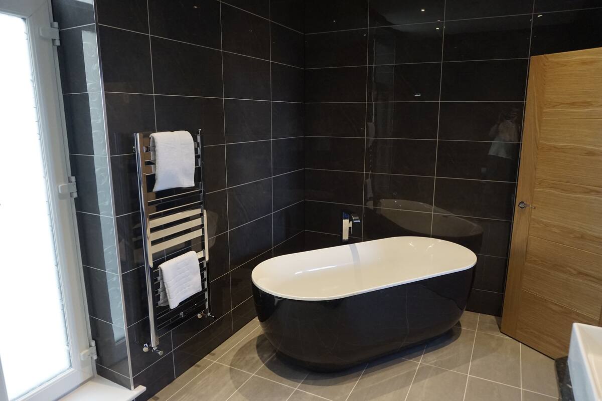 junior suite, 1 king bed, beach view | bathroom | free toiletries, hair dryer, slippers, towels