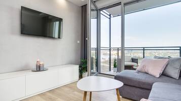 Apartment, City View | Living area | Flat-screen TV