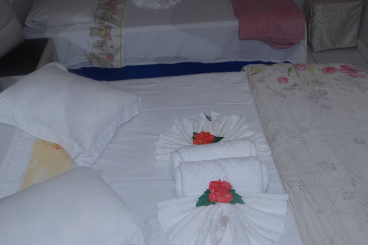 Basic Triple Room, 1 Bedroom, Shared Bathroom, Pool View | Desk, blackout curtains, iron/ironing board (on request), free WiFi