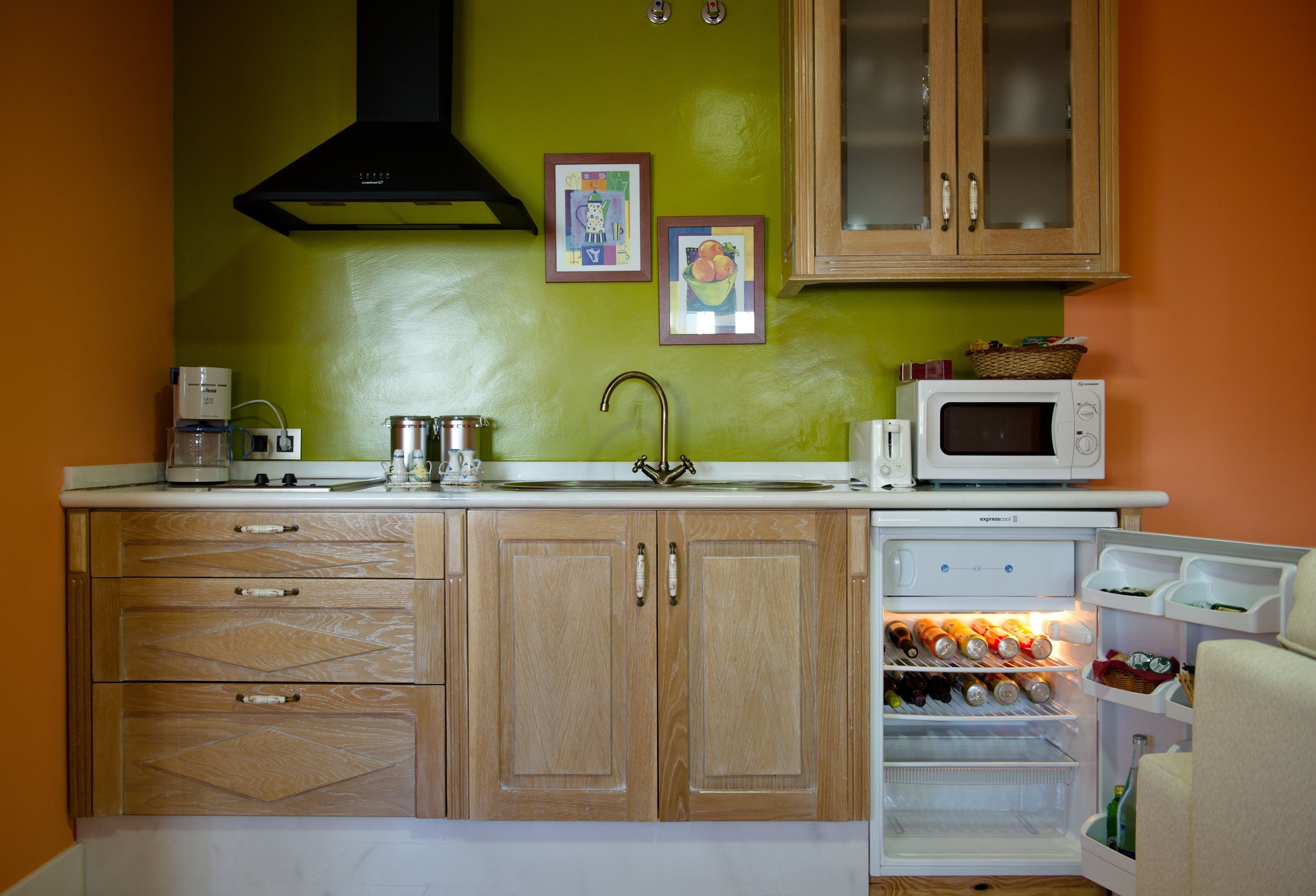 full-sized fridge, microwave, stovetop, coffee/tea maker