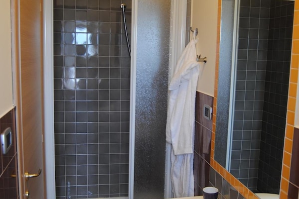 Shower, bathrobes, bidet, towels