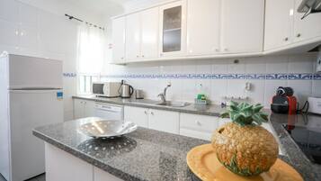 Apartment, 1 Bedroom, Balcony, Partial Sea View | Private kitchen | Fridge, microwave, oven, stovetop