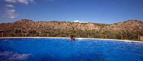 Outdoor pool, pool umbrellas, sun loungers