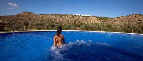 Outdoor pool, pool umbrellas, sun loungers