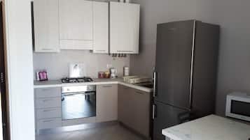 Apartment, 1 Bedroom | Private kitchenette | Full-size fridge, coffee/tea maker, electric kettle