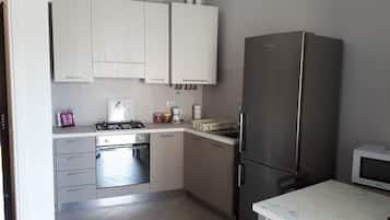 Apartment, 1 Bedroom | Private kitchenette | Full-sized fridge, coffee/tea maker, electric kettle