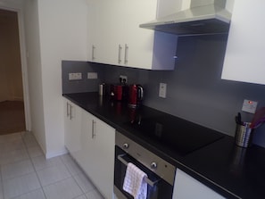 Apartment, 2 Bedrooms | Private kitchen | Fridge, microwave, oven, stovetop