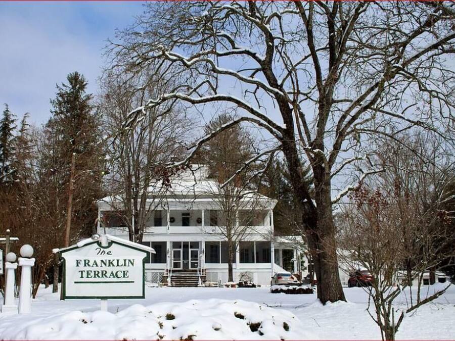 A two-story house with a sign reading "The Franklin Terrace."