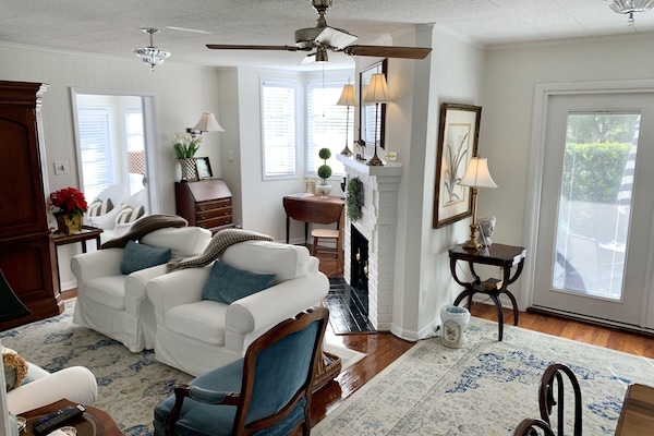 Living room also provides desk and chair in well lit alcove