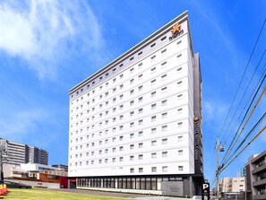 A multi-story hotel with a modern facade, numerous windows, and a visible sign indicating it is a hotel. - Vessel Hotel Campana Nagoya (Nagoya)