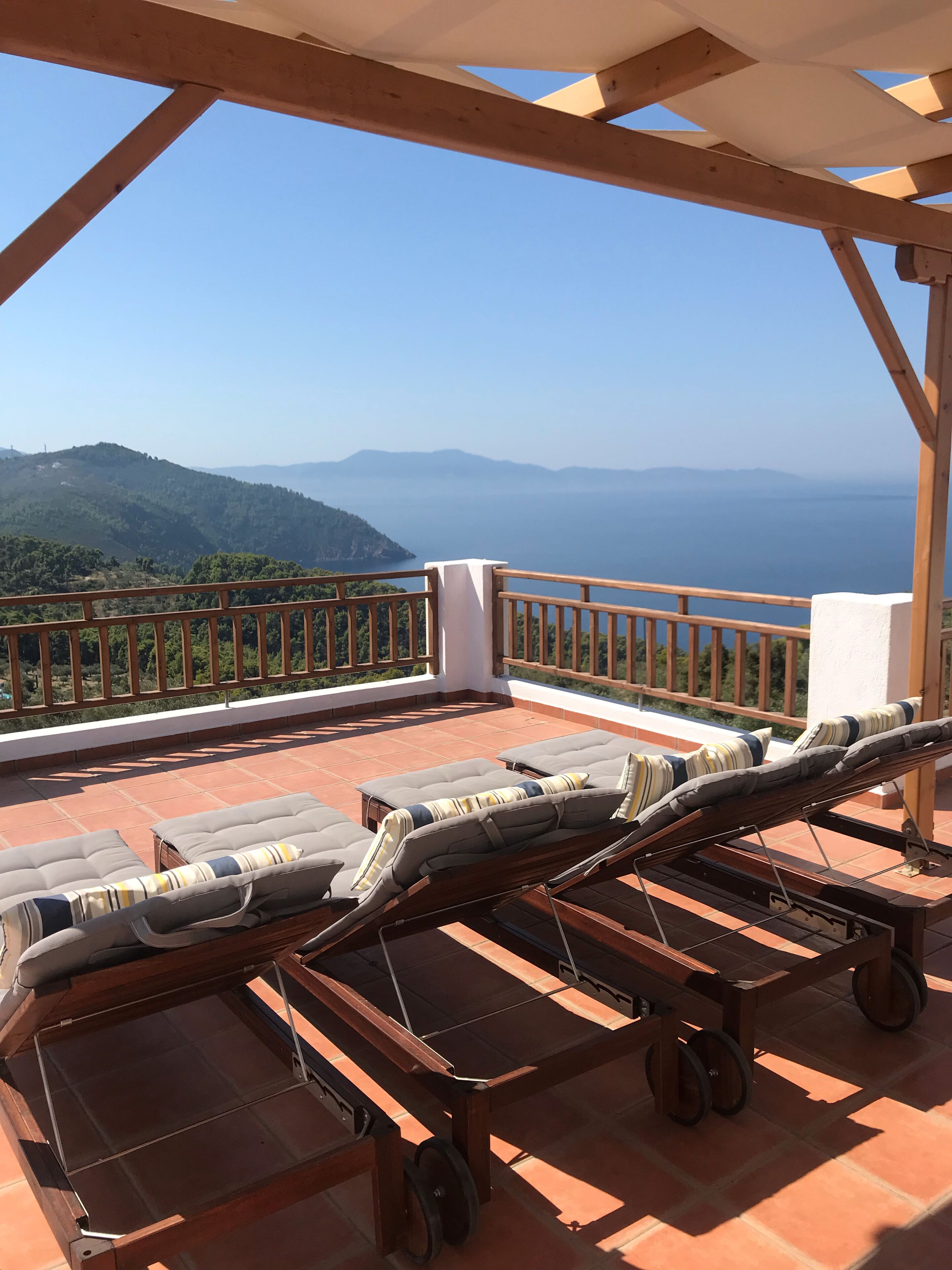 South facing 180 degree views overlooking the island and Skopelos. 
