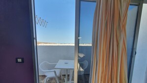 Cobertura urbana, 2 camas de solteiro, cozinha (Patronato H) | Terraço/pátio