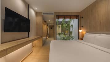 Junior Suite, 1 King Bed, Balcony, Pool View | Minibar, in-room safe, laptop workspace, blackout curtains