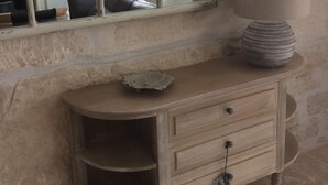 A bathroom with a large mirror, a vanity with a lamp, and a decorative shell on the counter. - In the heart of downtown St Rémy de Provence, the Mas D'Oscar! (Saint-Rémy-de-Provence)