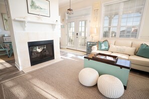 Flat-screen TV, fireplace, DVD player, books