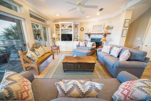 Taulutelevisio, DVD-soitin, kirjoja, videokirjasto