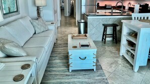 A modern kitchen with white cabinets, a stainless steel refrigerator, and a microwave. - Beachfront Penthouse Located On The 9th Floor with Two Balconies & Low Host Fee (Gulf Shores)
