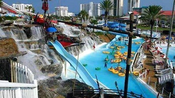 A water park with multiple slides and a pool area. - On the Beach, Panoramic Ocean View, Renovated Pelican Beach Condo (Destin)