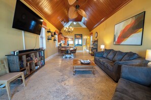 Flat-screen TV, DVD player, books, video library