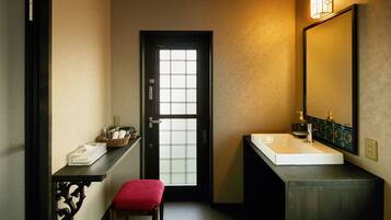 EAST Deluxe Suite | Bathroom | Separate tub and shower, deep soaking tub, free toiletries, hair dryer