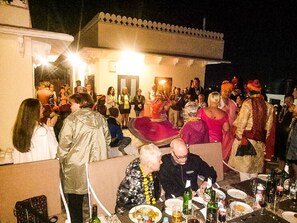 An outdoor gathering with people seated at tables, some in traditional attire, suggesting a cultural event. - Harsoli Haveli by Rivaa- A Heritage Boutique Hotel (Jaipur)