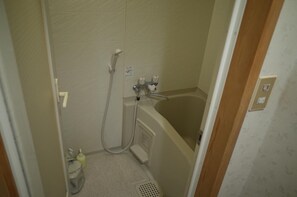 Combined shower/tub, free toiletries, hair dryer, slippers