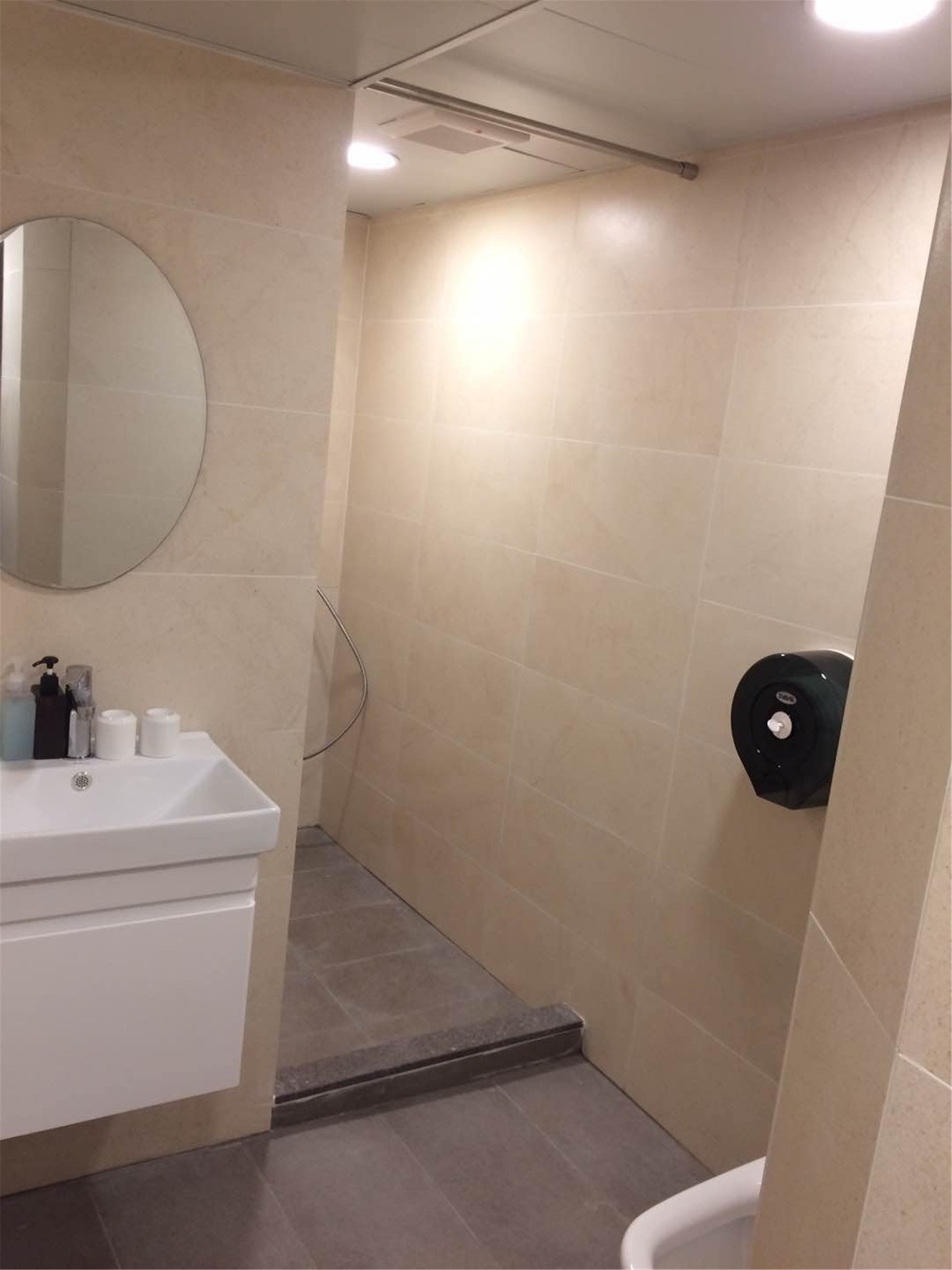 Shower, hair dryer, slippers, towels