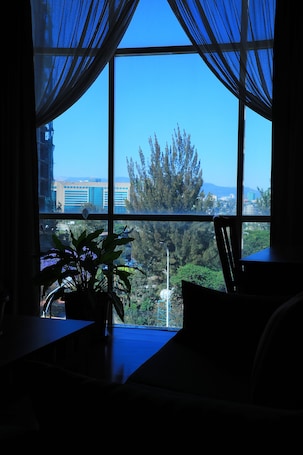 Luxury Room | Living area | 32-inch flat-screen TV with satellite channels, TV