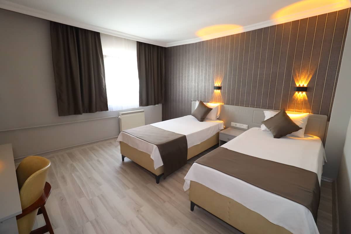 Standaard kamer | Luxe beddengoed, een kluis op de kamer, een laptopwerkplek